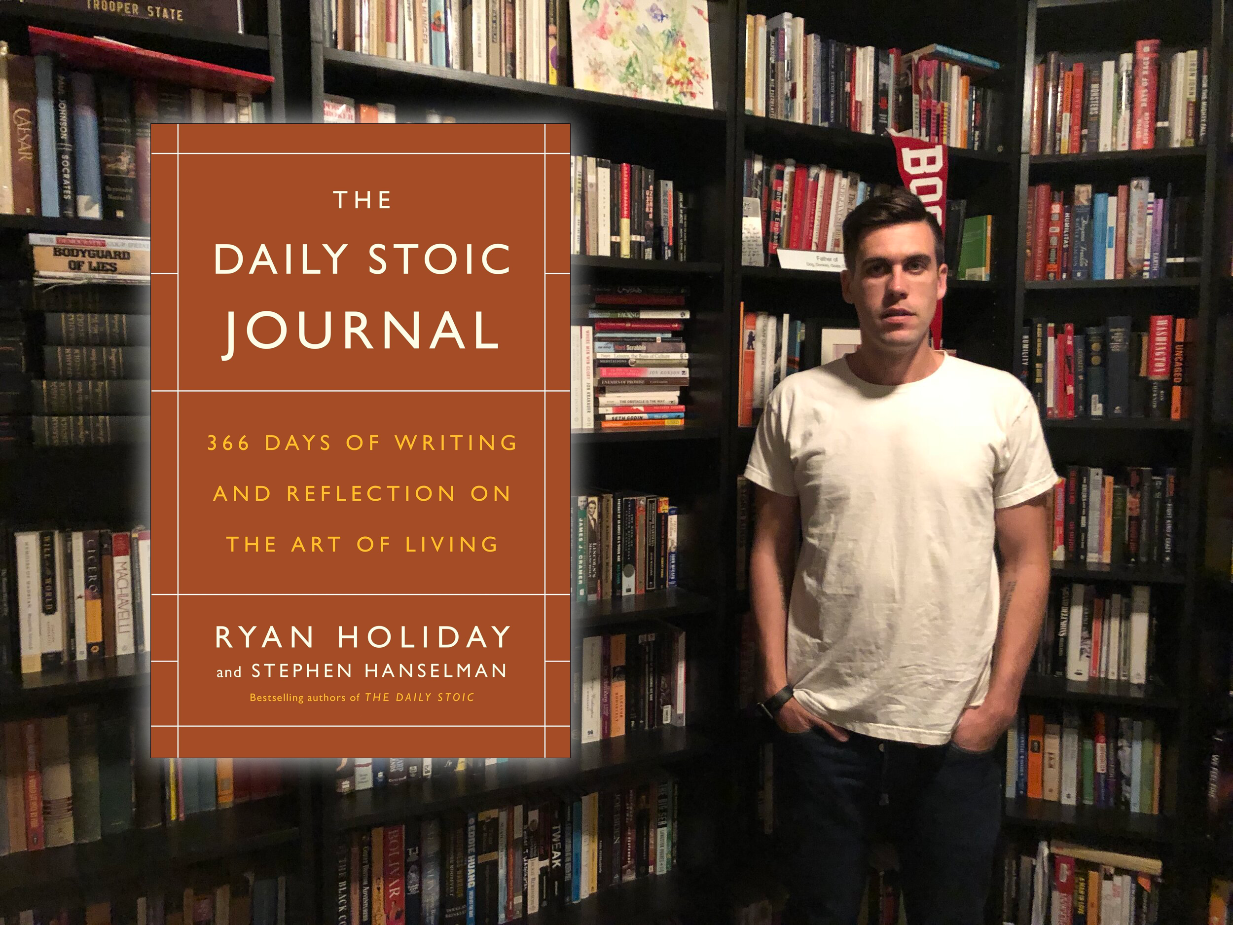 Ryan Holiday, author of "The Daily Stoic Journal" standing in front of a bookshelf